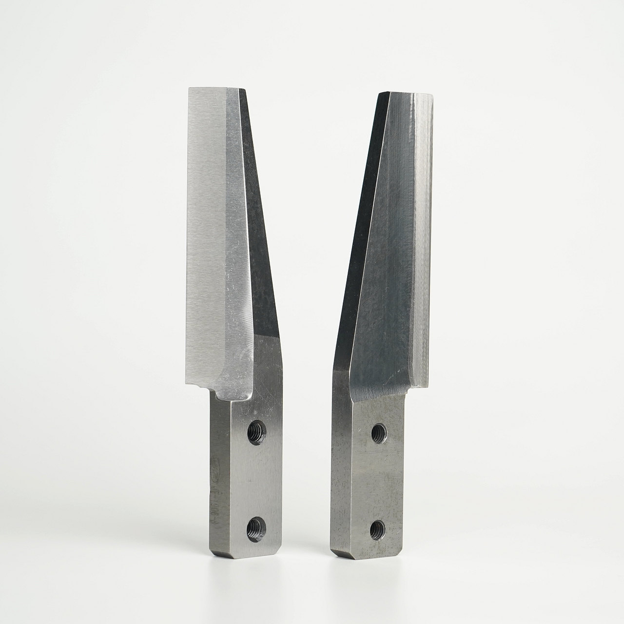 Two complete finished pelletizing knives on a neutral background
