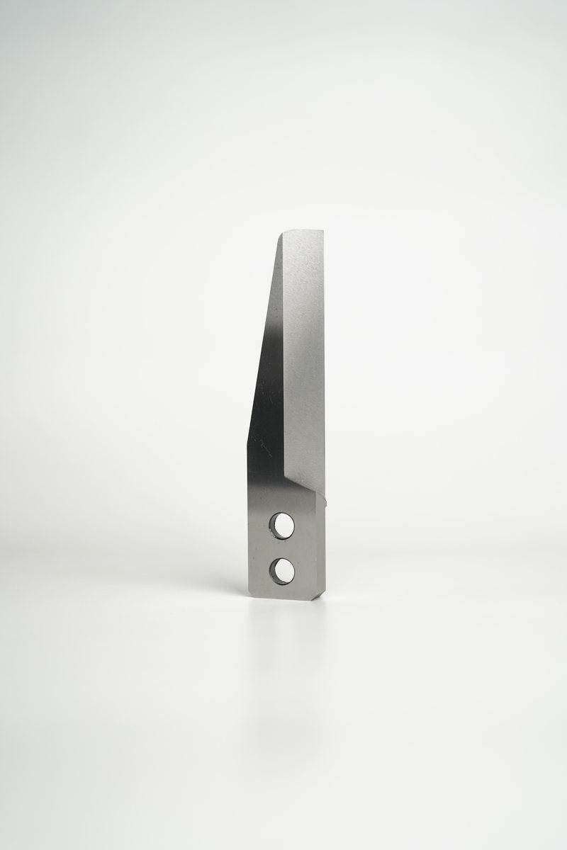 Machined pelletizer knife on a neutral background