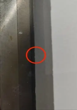 Imported pelletizer knife with a chipped cutting edge marked in red