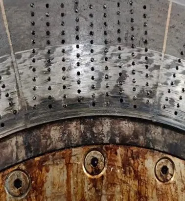 Hard face of a die plate in the pelletizer with damage from knife contact